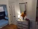 Bright entryway with mirror, console table, and hardwood floors at 1408 Brigham Rd, Chapel Hill, NC 27517