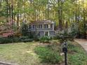 Gray house with white trim and a landscaped yard at 1408 Brigham Rd, Chapel Hill, NC 27517