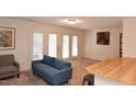 Living room with couches, a TV, and access to a patio at 1511 Creekwood Ct # 102, Raleigh, NC 27603