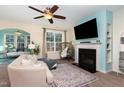 Living room features a fireplace, large TV, and comfortable seating at 206 Maple Walk St, Durham, NC 27703