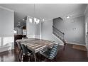 Open dining area with hardwood floors and staircase at 222 Sapphire Rd, Burlington, NC 27215