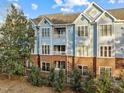 Multi-unit building, brick exterior, and attractive landscaping at 243 New Bern Pl # 301, Raleigh, NC 27601