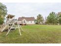 Spacious backyard with a playset and plenty of grass space at 270 W Silverado Ct, Kenly, NC 27542