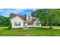 Charming, well-maintained home with landscaped yard and inviting front porch at 270 W Silverado Ct, Kenly, NC 27542