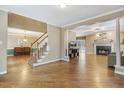 Spacious living room with hardwood floors, fireplace, and view of dining room at 312 Arlington Rdg, Cary, NC 27513