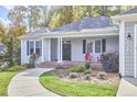Gray house with a front porch and walkway leading to the entrance at 4034 S Mcdowell, Pittsboro, NC 27312