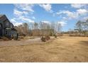 Spacious backyard with mature trees and open space at 430 Federal Rd, Benson, NC 27504
