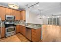 Modern kitchen with stainless steel appliances and granite countertops at 444 S Blount St # 316, Raleigh, NC 27601
