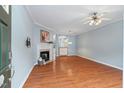 Living room with hardwood floors, fireplace and an open floor plan at 4533 Sugarbend Way, Raleigh, NC 27606