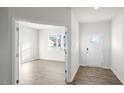 Bright entryway with hardwood floors and view into an office at 553 Tim Currin Rd, Lillington, NC 27546