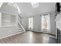 Bright living room featuring hardwood floors and a fireplace at 706 Sleepy Creek Dr, Durham, NC 27713