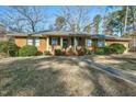 Ranch style brick home with a walkway leading to the front porch at 108 Pinewood Ave, Rocky Mount, NC 27804