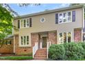 Inviting brick home featuring traditional design and well-maintained landscaping at 11712 Black Horse Run, Raleigh, NC 27613