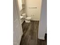 Clean bathroom with vinyl flooring, toilet, and sink at 1911 Wolftech Ln # 102, Raleigh, NC 27603