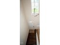 High ceilings and hardwood floors in the entryway, with a view of the staircase at 248 Begen St, Morrisville, NC 27560