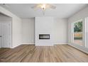 Living room with fireplace and wood-look floors at 502 E Elizabeth St, Selma, NC 27576