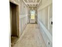 Hallway features a rear door allowing for natural light at 5377 River Buck Rd, Spring Hope, NC 27882