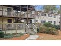 Two-story building with wooden decks and stairs at 550 Pine Ridge Pl, Raleigh, NC 27609