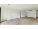 Spacious living room with light walls and wood-look floors at 550 Pine Ridge Pl, Raleigh, NC 27609