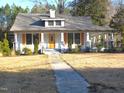 Renovated craftsman home featuring a welcoming front porch and walkway at 815 N Durham Ave, Creedmoor, NC 27522