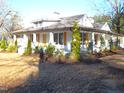 Newly renovated home with a large wrap-around porch at 815 N Durham Ave, Creedmoor, NC 27522