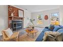 Cozy living room featuring a brick fireplace and comfy seating at 9 Misty Creek Ct, Durham, NC 27705