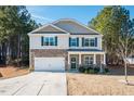 Two-story house with stone accents and a two-car garage at 98 Panmure, Rocky Mount, NC 27804