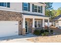 Two-story house with stone accents and a covered porch at 98 Panmure, Rocky Mount, NC 27804