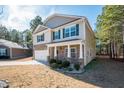 Two-story house with stone accents and a covered porch at 98 Panmure, Rocky Mount, NC 27804