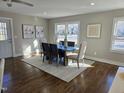 Bright dining room with hardwood floors and large windows providing ample natural light at 1014 E Jones St, Raleigh, NC 27601