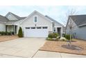 Landscaped lawn, a two-car garage, and a lovely front exterior define this quaint home at 125 Canary Ct. Ct, Raleigh, NC 27610