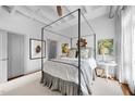 Bright bedroom with a canopy bed and plenty of natural light at 1300 St Marys St # 404, Raleigh, NC 27605