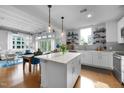 Modern kitchen featuring a large island and stainless steel appliances at 1300 St Marys St # 404, Raleigh, NC 27605