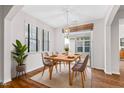 Cozy dining area featuring natural light, a pendant light, and access to a backyard patio at 1400 Basley St, Wake Forest, NC 27587