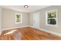Simple bedroom with hardwood floors and neutral walls at 1712 Rosetta Dr, Durham, NC 27701