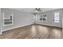 Spacious living area featuring hardwood floors and neutral walls at 201 Brickwell Way, Youngsville, NC 27596