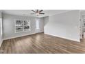 Open living space with hardwood floors and access to the front entrance at 201 Brickwell Way, Youngsville, NC 27596