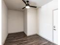 Spacious bedroom with dark gray vinyl plank flooring and ceiling fan at 2325 Gathering Square Ct Ct # 2325, Fuquay Varina, NC 27526