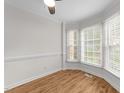 Bright dining area featuring wood floors, bay window, and fresh paint at 4541 Hershey Ct, Raleigh, NC 27613