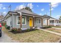Gray craftsman home with a welcoming front porch and landscaping at 504 Branch St, Raleigh, NC 27601