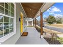Inviting front porch with wood posts and a covered area at 504 Branch St, Raleigh, NC 27601