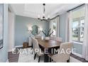 Formal dining room with a wooden table and light walls at 53 Priming Way, Angier, NC 27501