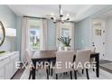 Formal dining room with a wooden table and light walls at 53 Priming Way, Angier, NC 27501