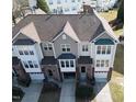 Stunning aerial view of townhomes with landscaped yards and private garages in a well-maintained neighborhood at 5409 Crescentview Pkwy, Raleigh, NC 27606