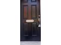 Black front door with a silver address plaque, 5409 at 5409 Crescentview Pkwy, Raleigh, NC 27606