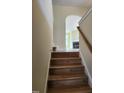 Wooden staircase leading to the second floor at 5409 Crescentview Pkwy, Raleigh, NC 27606
