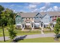Row of townhouses viewed from above, showcasing the community layout at 705 Traditions Grande Blvd, Wake Forest, NC 27587