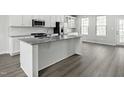 Modern kitchen with granite countertops and stainless steel appliances at 803 Bright Nova Way, Wendell, NC 27591