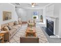 Virtually staged living room with fireplace and neutral decor at 83 Valleyfield Dr, Clayton, NC 27527