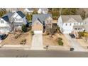 Aerial view of a brick home in a residential neighborhood at 912 Jewel Stone Ln, Morrisville, NC 27560